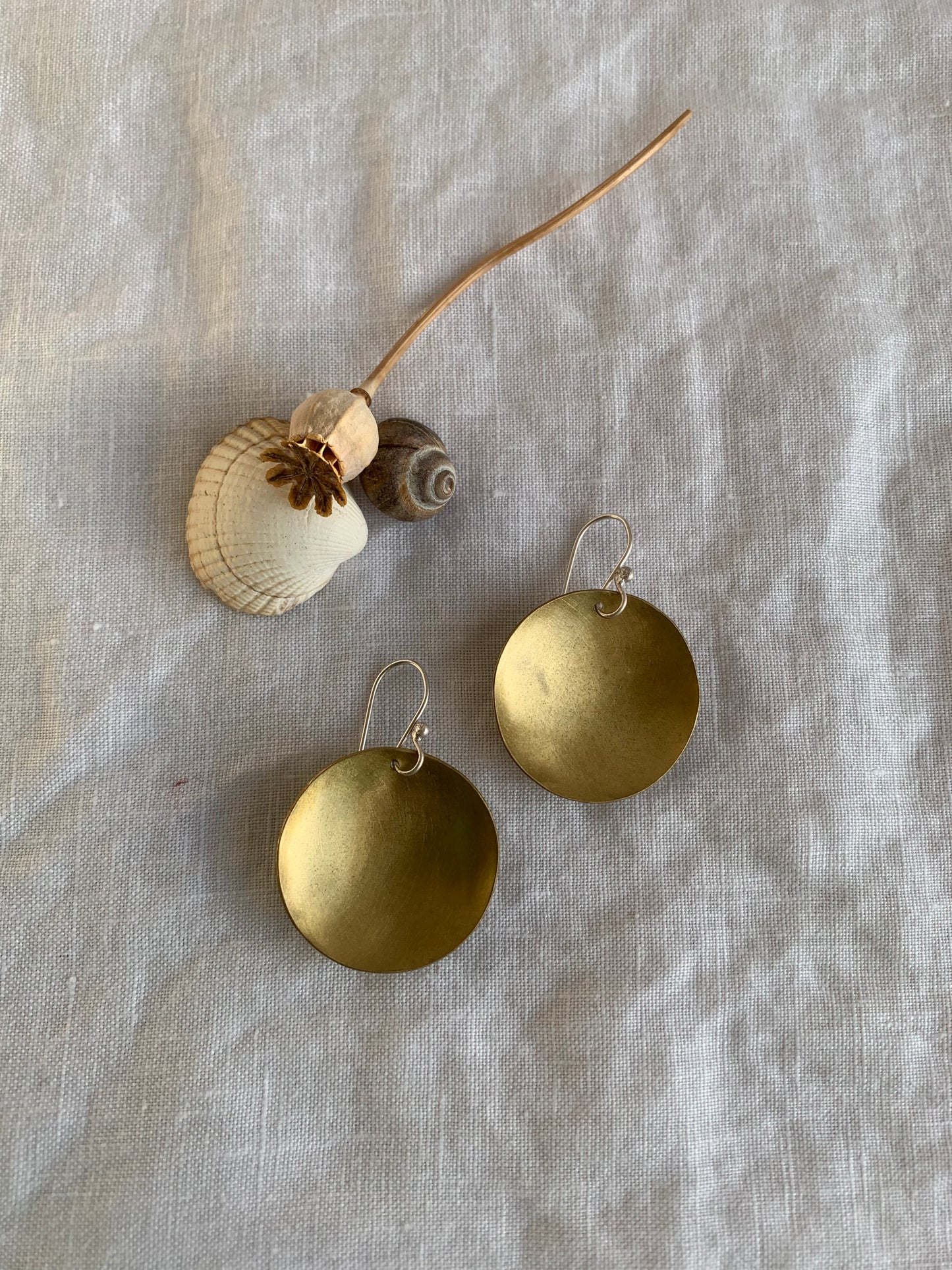 Small Golden Moon drop earrings.